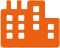 Bâtiment en pixel art orange avec fenêtres noires. Sa structure complexe rappelle une usine ou un immeuble commercial moderne.
